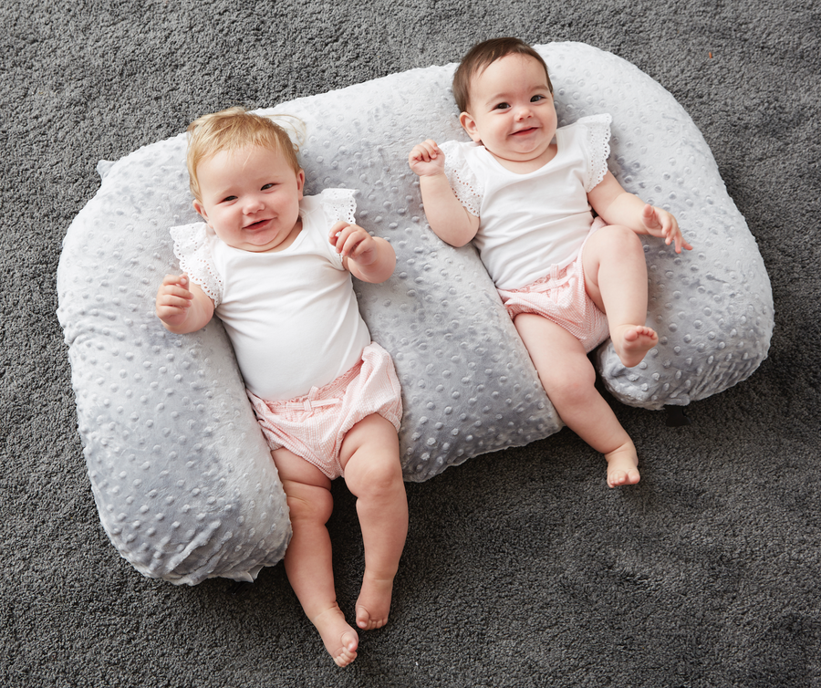twin feeding pillows babies lying on back
