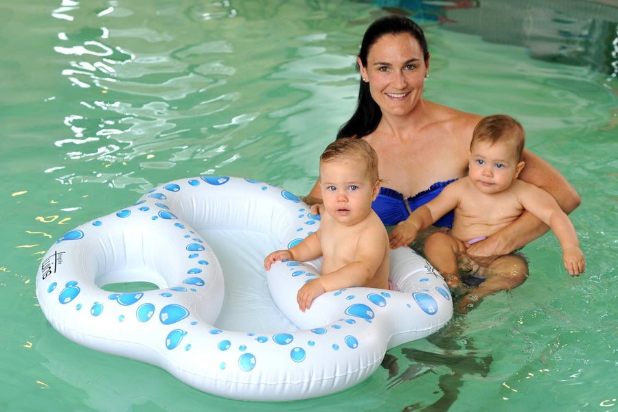 twin pool float one baby in arms